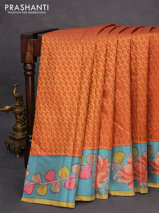 Pure kanchipuram silk saree rustic orange and teal blue with allover zari woven paisley brocade weaves and kalamkari printed pallu & border