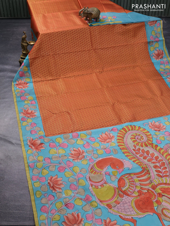 Pure kanchipuram silk saree rustic orange and teal blue with allover zari woven paisley brocade weaves and kalamkari printed pallu & border