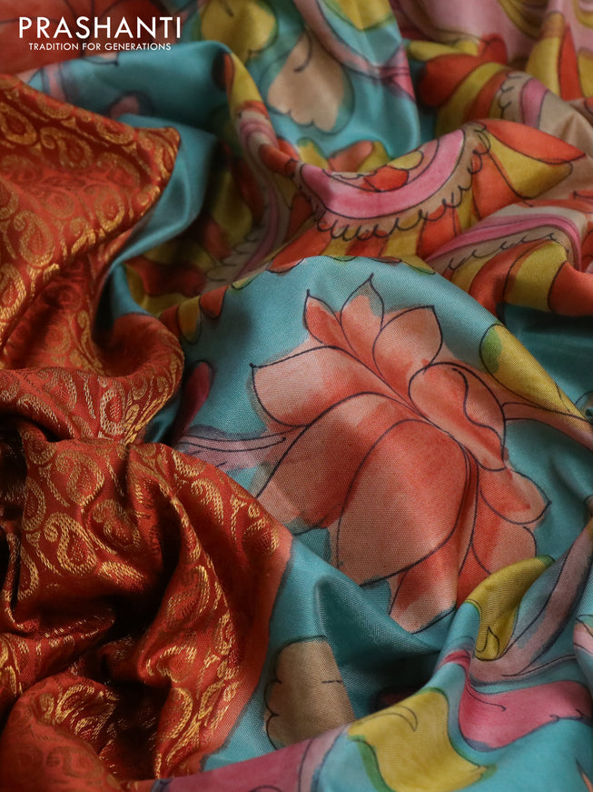 Pure kanchipuram silk saree rustic orange and teal blue with allover zari woven paisley brocade weaves and kalamkari printed pallu & border