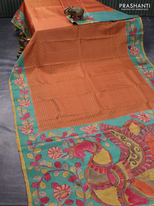 Pure kanchipuram silk saree rust shade and teal green with allover zari woven brocade weaves and kalamkari printed pallu & border
