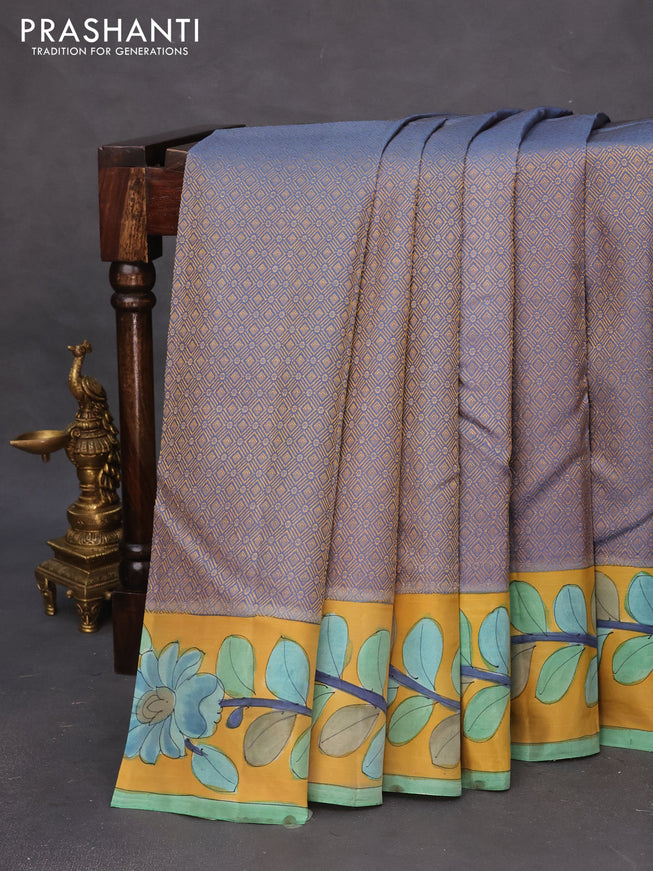 Pure kanchipuram silk saree blue shade and mustard yellow with allover zari woven geometric brocade weaves and kalamkari printed pallu & border