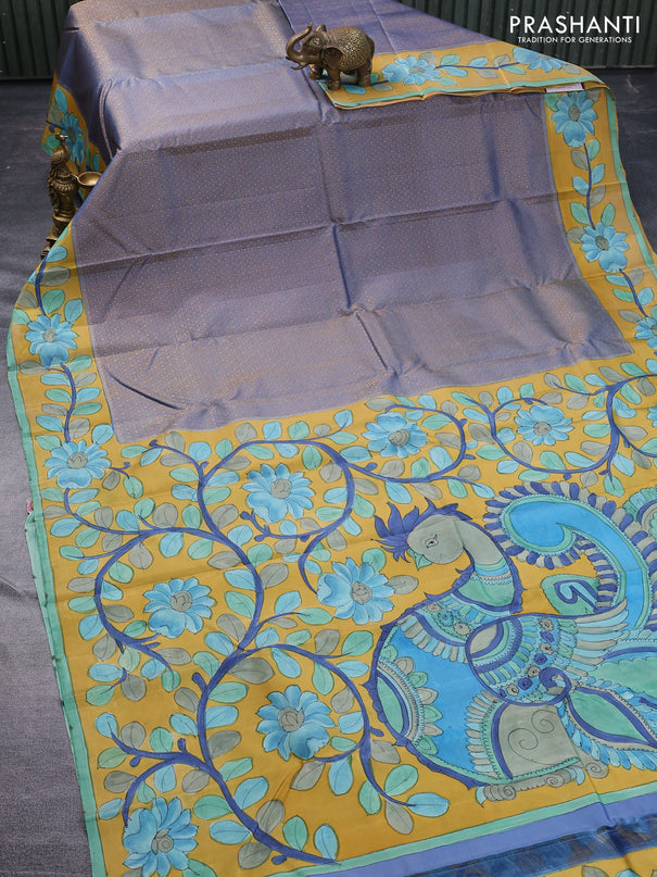 Pure kanchipuram silk saree blue shade and mustard yellow with allover zari woven geometric brocade weaves and kalamkari printed pallu & border
