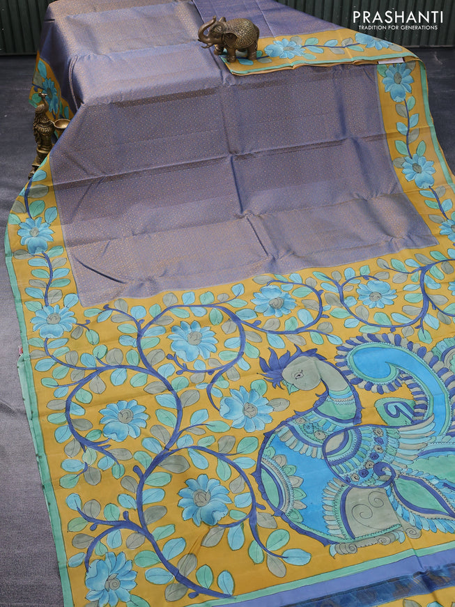 Pure kanchipuram silk saree blue shade and mustard yellow with allover zari woven geometric brocade weaves and kalamkari printed pallu & border