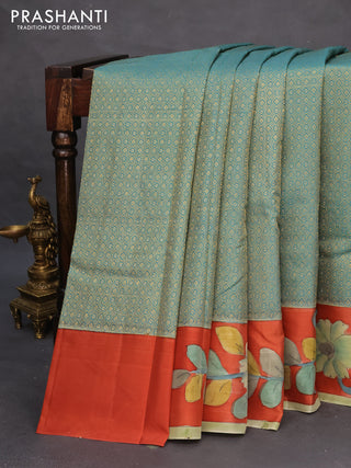 Pure kanchipuram silk saree teal blue and rustic orange with allover zari woven geometric brocade weaves and kalamkari printed pallu & border