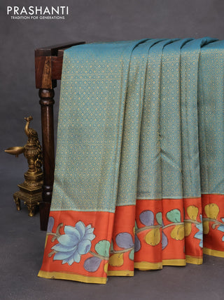 Pure kanchipuram silk saree pastel blue and rustic orange with allover zari woven geometric brocade weaves and kalamkari printed pallu & border