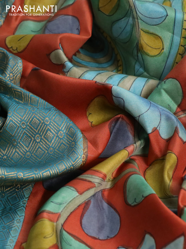 Pure kanchipuram silk saree pastel blue and rustic orange with allover zari woven geometric brocade weaves and kalamkari printed pallu & border