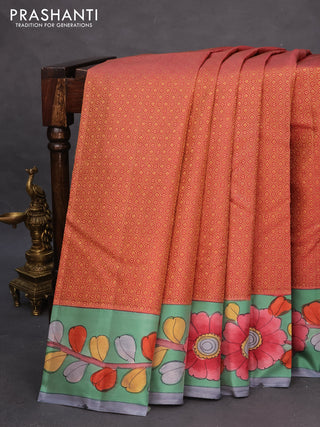 Pure kanchipuram silk saree dark peach shade and teal green shade with allover zari woven geometric brocade weaves and kalamkari printed pallu & border