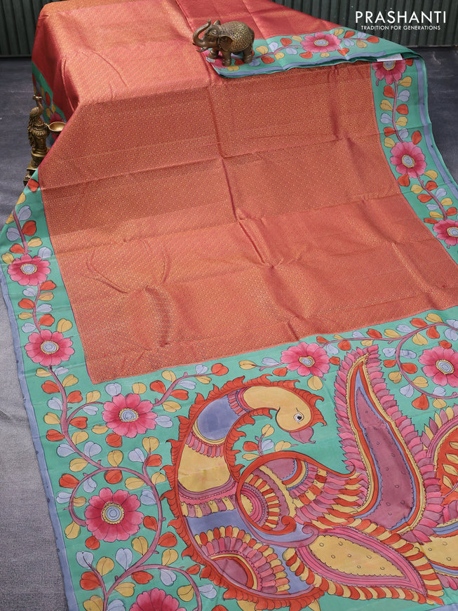 Pure kanchipuram silk saree dark peach shade and teal green shade with allover zari woven geometric brocade weaves and kalamkari printed pallu & border