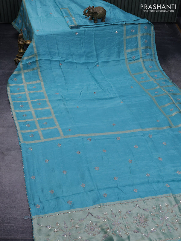 Satin crepe silk saree teal blue with mirror work buttas and zari checked & stone work border