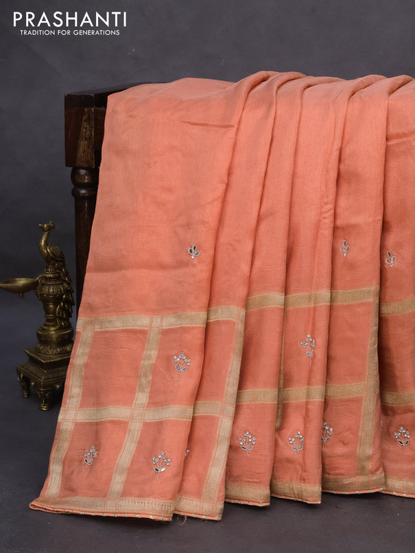 Satin crepe silk saree peach orange with mirror work buttas and zari checked & stone work border