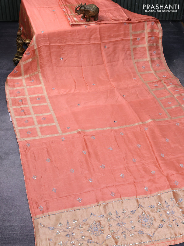 Satin crepe silk saree peach orange with mirror work buttas and zari checked & stone work border