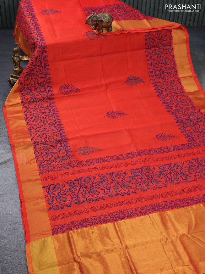 Silk cotton block printed saree orange with leaf butta prints and zari woven border