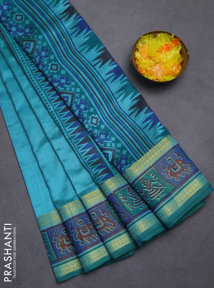 Semi tussar saree dual shade of teal blue with plain body and ikat woven zari border