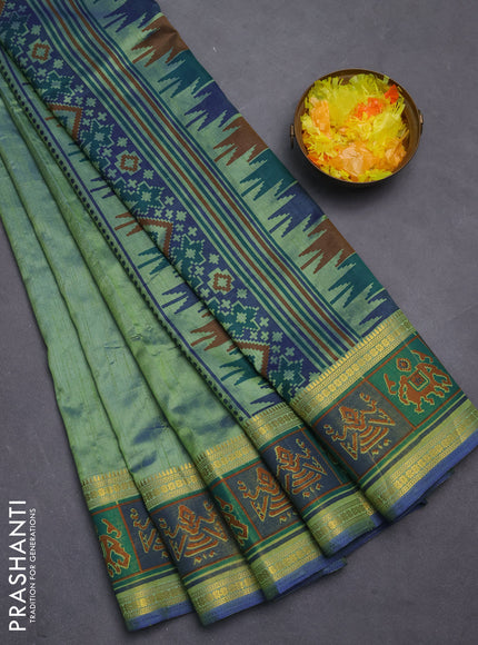 Semi tussar saree dual shade of greenish blue with plain body and ikat woven zari border