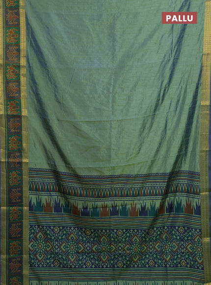 Semi tussar saree dual shade of greenish blue with plain body and ikat woven zari border