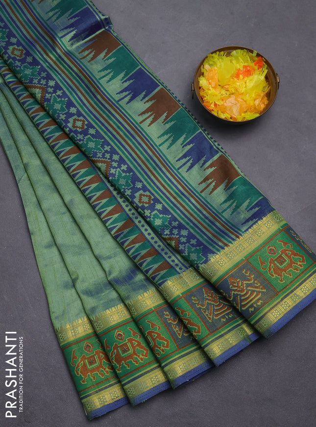 Semi tussar saree dual shade of greenish blue with plain body and ikat woven zari border