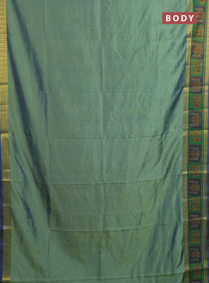 Semi tussar saree dual shade of greenish blue with plain body and ikat woven zari border