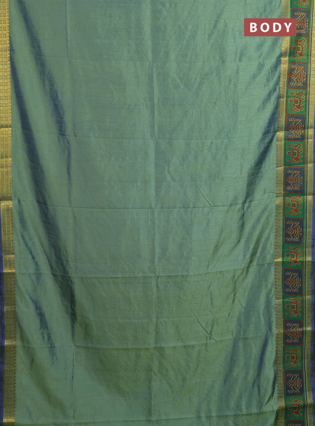 Semi tussar saree dual shade of greenish blue with plain body and ikat woven zari border