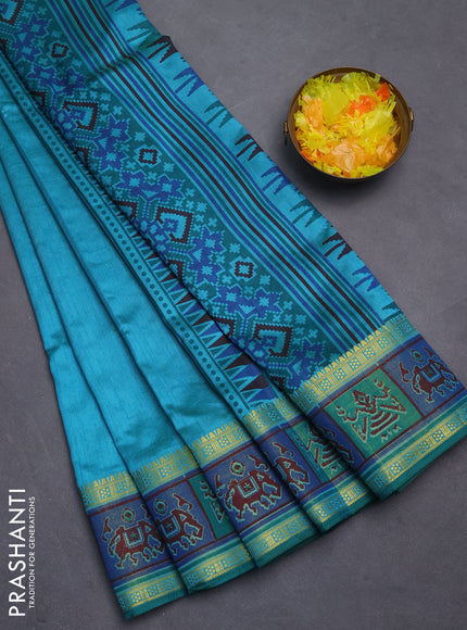 Semi tussar saree teal blue with plain body and ikat woven zari border