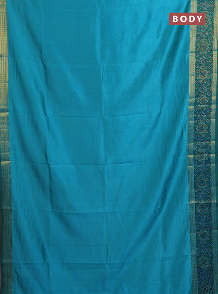 Semi tussar saree dual shade of teal blue with plain body and ikat woven zari border