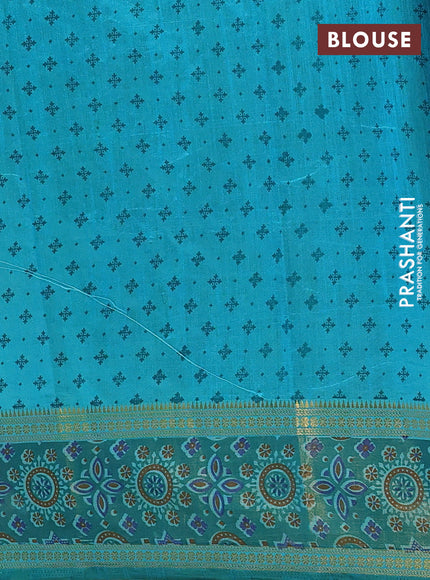 Semi tussar saree dual shade of teal blue with plain body and ikat woven zari border