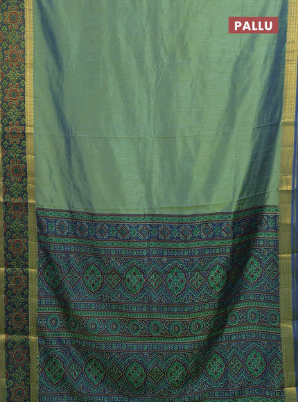 Semi tussar saree dual shade of green and blue with plain body and ikat woven zari border
