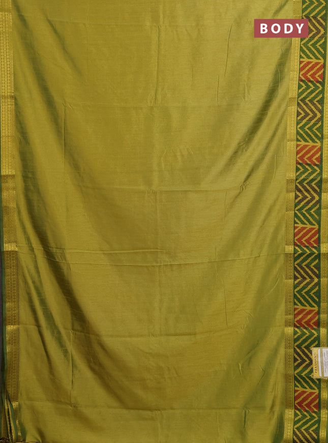 Semi tussar saree dual shade of light green with plain body and ikat woven zari border