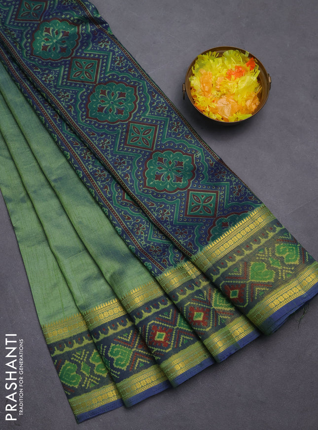 Semi tussar saree dual shade of greenish blue with plain body and ikat woven zari border