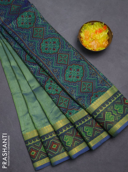 Semi tussar saree dual shade of greenish blue with plain body and ikat woven zari border