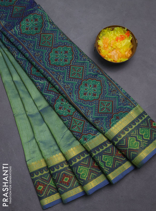Semi tussar saree dual shade of greenish blue with plain body and ikat woven zari border