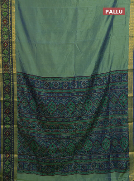 Semi tussar saree dual shade of greenish blue with plain body and ikat woven zari border