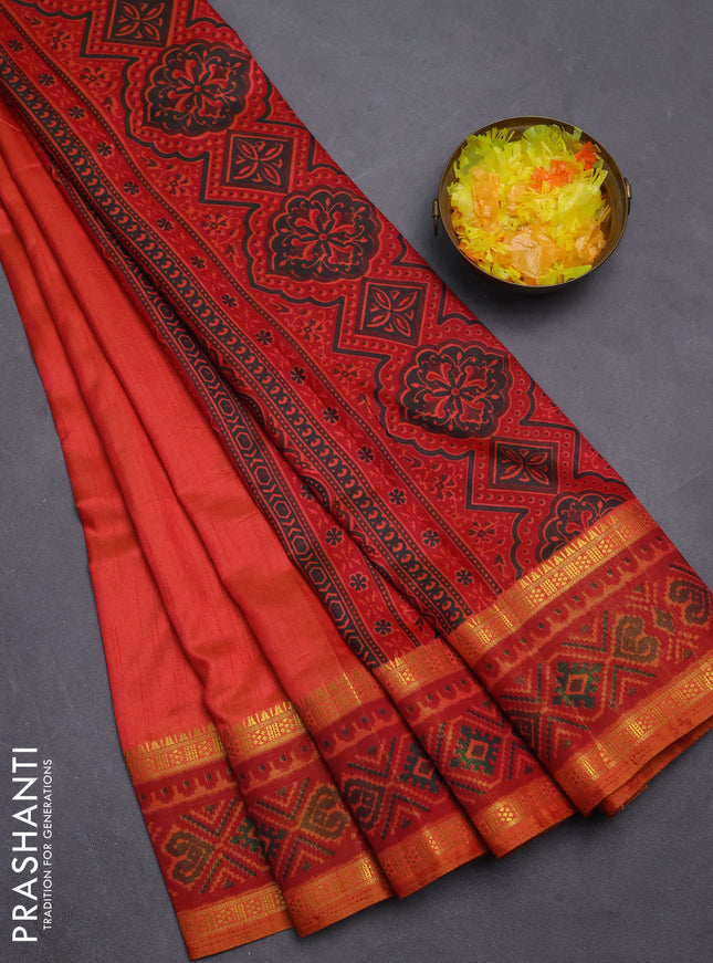 Semi tussar saree dual shade of pinkish orange with plain body and ikat woven zari border