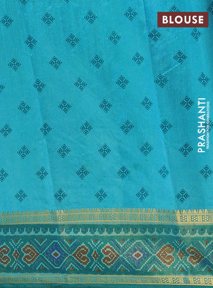 Semi tussar saree dual shade of teal blue with plain body and ikat woven zari border