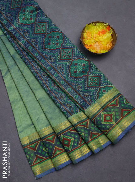Semi tussar saree dual shade of greenish blue with plain body and ikat woven zari border