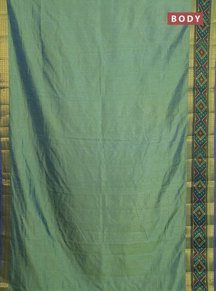 Semi tussar saree dual shade of greenish blue with plain body and ikat woven zari border
