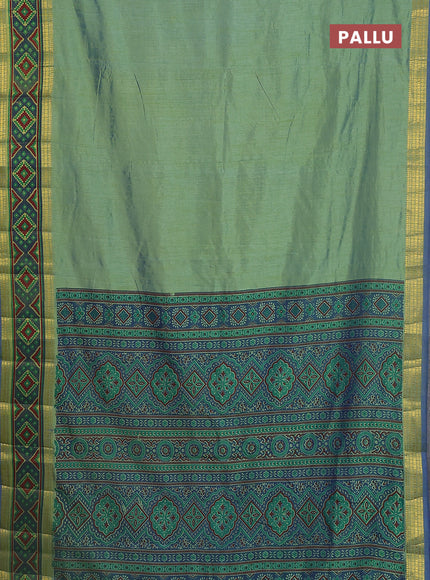 Semi tussar saree dual shade of greenish blue with plain body and ikat woven zari border