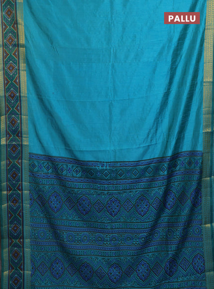 Semi tussar saree dual shade of teal blue with plain body and ikat woven zari border