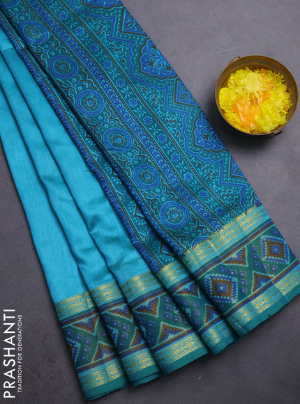 Semi tussar saree dual shade of teal blue with plain body and ikat woven zari border