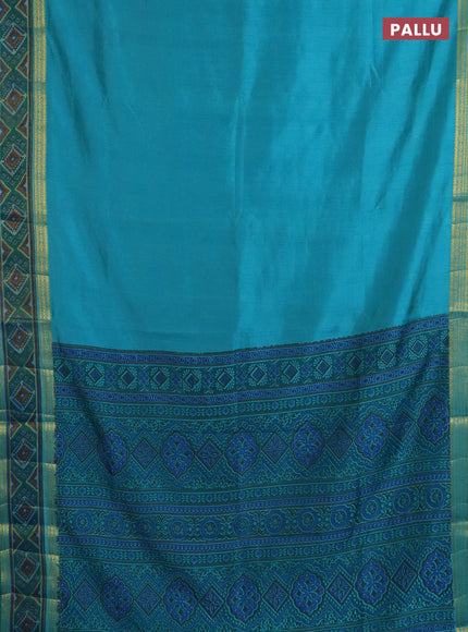 Semi tussar saree dual shade of teal blue with plain body and ikat woven zari border