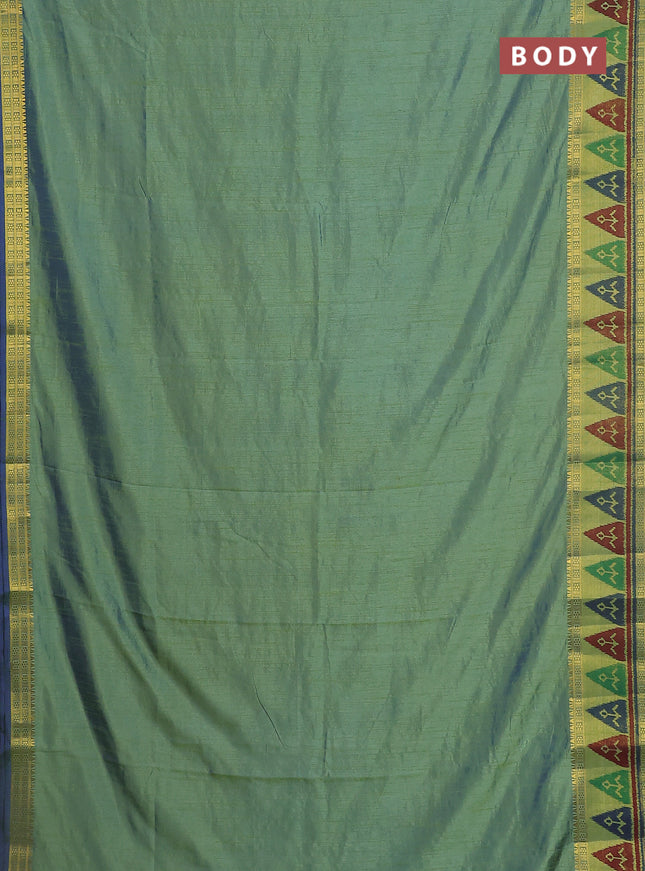Semi tussar saree dual shade of greenish blue with plain body and ikat woven zari border