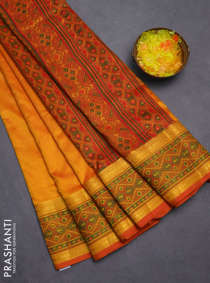 Semi tussar saree dual shade of mustard yellow and red with plain body and ikat woven zari border