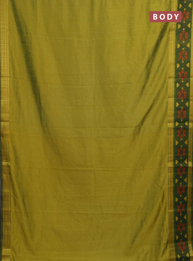 Semi tussar saree dual shade of light green and green with plain body and ikat woven zari border