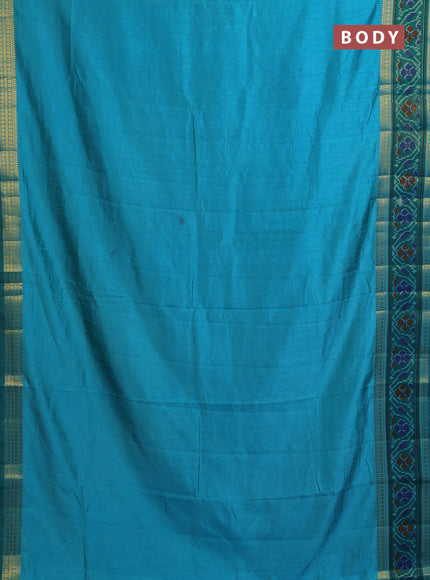 Semi tussar saree dual shade of teal blue and teal green with plain body and ikat woven zari border