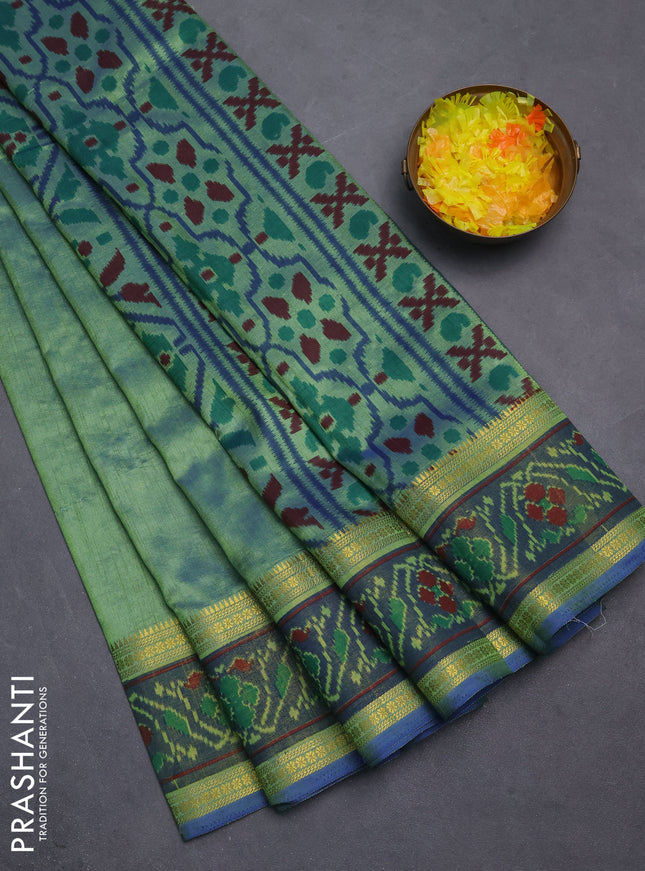 Semi tussar saree dual shade of greenish blue and blue with plain body and ikat woven zari border