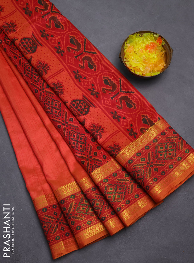Semi tussar saree dual shade of pinkish orange and maroon with plain body and ikat woven zari border