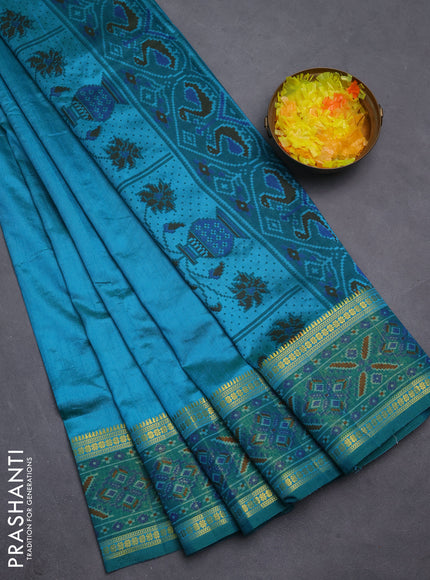 Semi tussar saree teal blue and green with plain body and ikat woven zari border