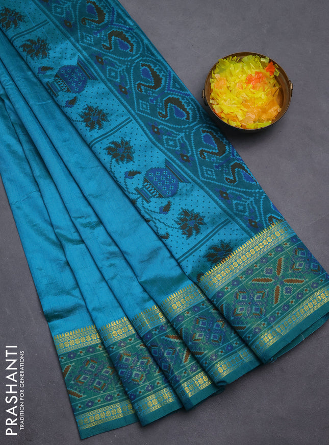 Semi tussar saree teal blue and green with plain body and ikat woven zari border