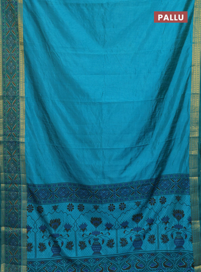Semi tussar saree teal blue and green with plain body and ikat woven zari border