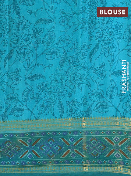 Semi tussar saree teal blue and green with plain body and ikat woven zari border