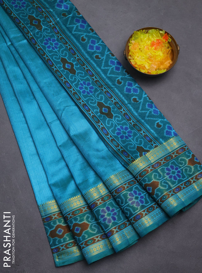 Semi tussar saree dual shade of teal blue and green with plain body and ikat woven zari border